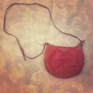 Orange crossbody Coach purse